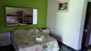
Cama ou camas em um quarto em Pousada Ferradura Beach
