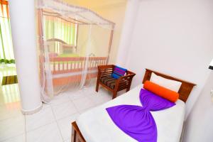 Postel nebo postele na pokoji v ubytování Peacock Beach Hotel Unawatuna