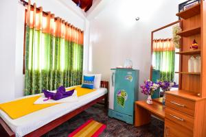 Postel nebo postele na pokoji v ubytování Peacock Beach Hotel Unawatuna