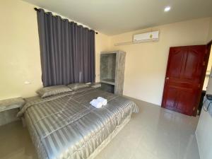 Postel nebo postele na pokoji v ubytování Budchui Guesthouse