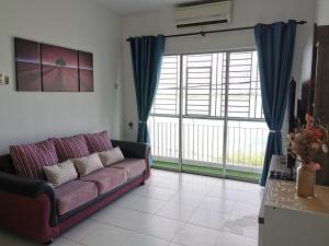 a living room with a couch and a large window at Lake Residence 167 aesthetic lakeview best photograph in Putrajaya