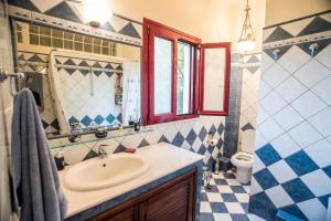 a bathroom with a sink and a mirror at Galaxidi Mansion in Galaxidhion +41 photos