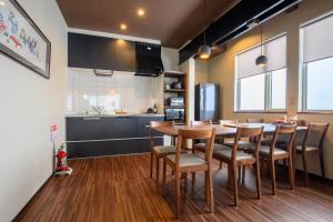 a kitchen and dining room with a table and chairs at Iroha Nozawa in Nozawa Onsen