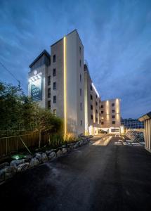 a large building is lit up at night at Centro Hotel in Chilgok