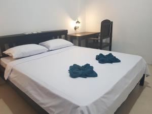 Postel nebo postele na pokoji v ubytování Talent Resort