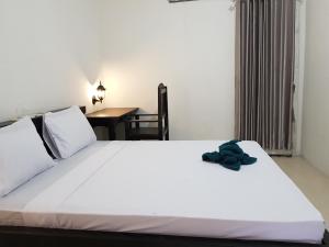 Postel nebo postele na pokoji v ubytování Talent Resort