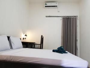 Postel nebo postele na pokoji v ubytování Talent Resort