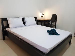 Postel nebo postele na pokoji v ubytování Talent Resort