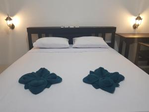 Postel nebo postele na pokoji v ubytování Talent Resort