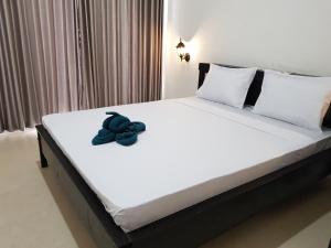 Postel nebo postele na pokoji v ubytování Talent Resort