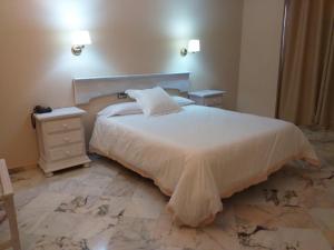 Кровать или кровати в номере Hotel Anfiteatro Romano