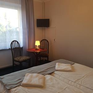 Postel nebo postele na pokoji v ubytování Pensjonat MALWA