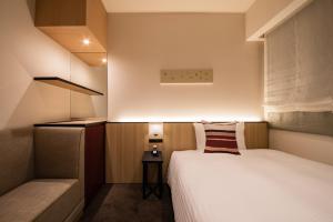 Postel nebo postele na pokoji v ubytování Hotel Vista Fukuoka Nakasu-Kawabata
