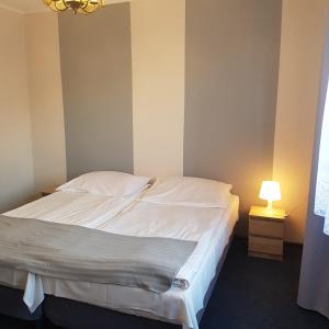 Postel nebo postele na pokoji v ubytování Pensjonat MALWA