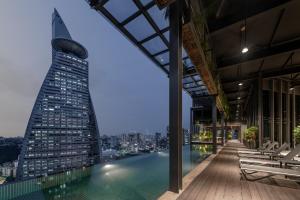 a view of the shard from the rooftop of a building at Komune Living in Kuala Lumpur