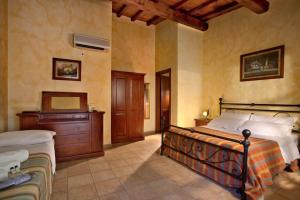 Posteľ alebo postele v izbe v ubytovaní Villa Hotel Valle Del Marta Resort