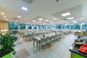 a large dining room with tables and chairs at HI - Bnei Dan - Tel Aviv Hostel in Tel Aviv