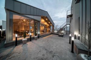 a building with a patio with lights on it at Centro Hotel in Chilgok