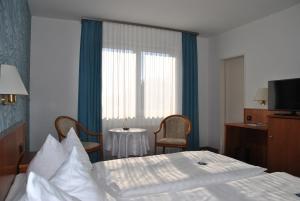 Postel nebo postele na pokoji v ubytování Hotel Pesterwitzer Siegel
