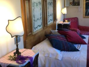 Posteľ alebo postele v izbe v ubytovaní La Cantina Relais - Fattoria Il Cipresso