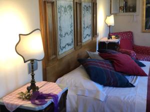 Posteľ alebo postele v izbe v ubytovaní La Cantina Relais - Fattoria Il Cipresso