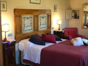 Posteľ alebo postele v izbe v ubytovaní La Cantina Relais - Fattoria Il Cipresso