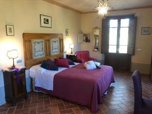 Posteľ alebo postele v izbe v ubytovaní La Cantina Relais - Fattoria Il Cipresso