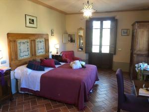 Posteľ alebo postele v izbe v ubytovaní La Cantina Relais - Fattoria Il Cipresso