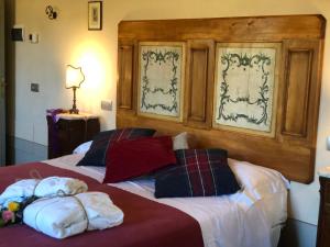 Posteľ alebo postele v izbe v ubytovaní La Cantina Relais - Fattoria Il Cipresso