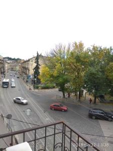 a view of a city street with cars on the road at Aparthotel NA DOBU in Lviv