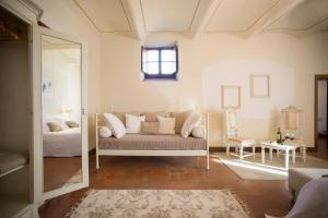 a living room filled with furniture and a window at Castello Di Gabbiano in Mercatale Val Di Pesa