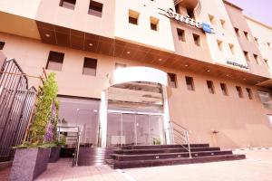 a building with a staircase in front of it at Suite blue in Dammam