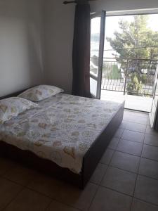 Ein Bett oder Betten in einem Zimmer der Unterkunft Apartments Vrša