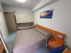 Postel nebo postele na pokoji v ubytování Hotel Casale dei Greci