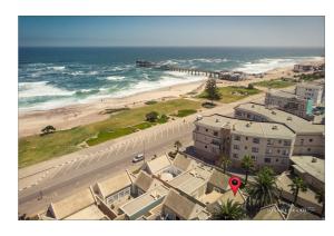 an aerial view of a beach and the ocean at Bruckendorf Self Catering Apartment in Swakopmund