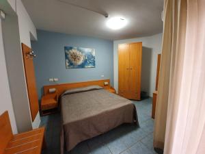 Postel nebo postele na pokoji v ubytování Hotel Casale dei Greci