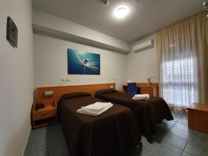 Postel nebo postele na pokoji v ubytování Hotel Casale dei Greci
