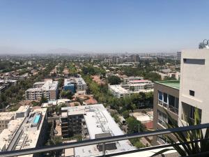 an aerial view of a city with buildings at Departamento Nuevo Plaza Ñuñoa in Santiago