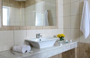 Een badkamer bij Cosman Hotel