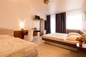Tempat tidur dalam kamar di Hotel Buschhausen
