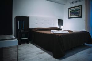 Postel nebo postele na pokoji v ubytování Hotel Casale dei Greci