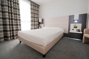 Postel nebo postele na pokoji v ubytování Hotel Rivarolo + 37 fotografií