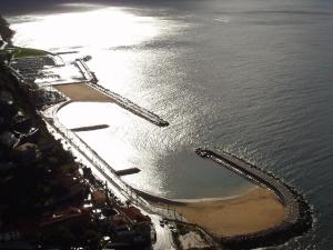 an aerial view of a beach and the water at Madeira-Meerblick-Haus in Estreito da Calheta