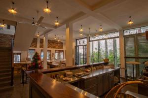 a large kitchen with a christmas tree on the counter at Brixia Cafe & Guest in Galle