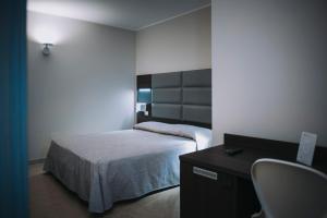 Postel nebo postele na pokoji v ubytování Hotel Casale dei Greci