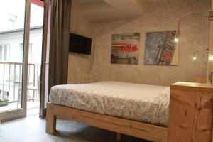 Postel nebo postele na pokoji v ubytování B&B Corte Rossa