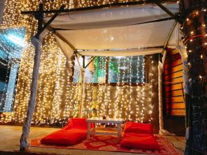 a gazebo with christmas lights in a room at Sunrise Resort- Koh Phangan - SHA Extra Plus in Haad Rin