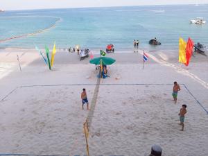 a group of people on a beach with kites at Sunrise Resort- Koh Phangan - SHA Extra Plus in Haad Rin