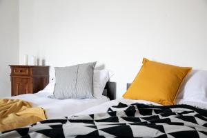 A bed or beds in a room at IseoLakeRental - La Stallina - Monte Isola