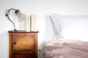 A bed or beds in a room at IseoLakeRental - La Stallina - Monte Isola